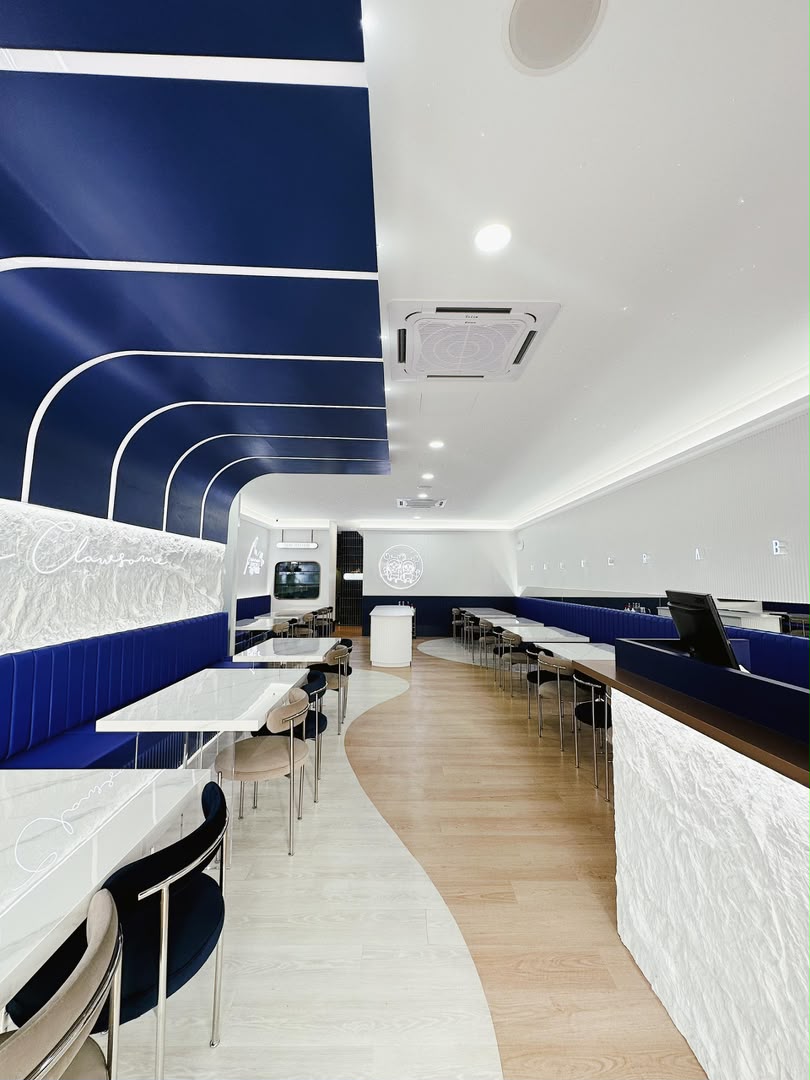 Talk Crab restaurant interior with navy blue ceiling design